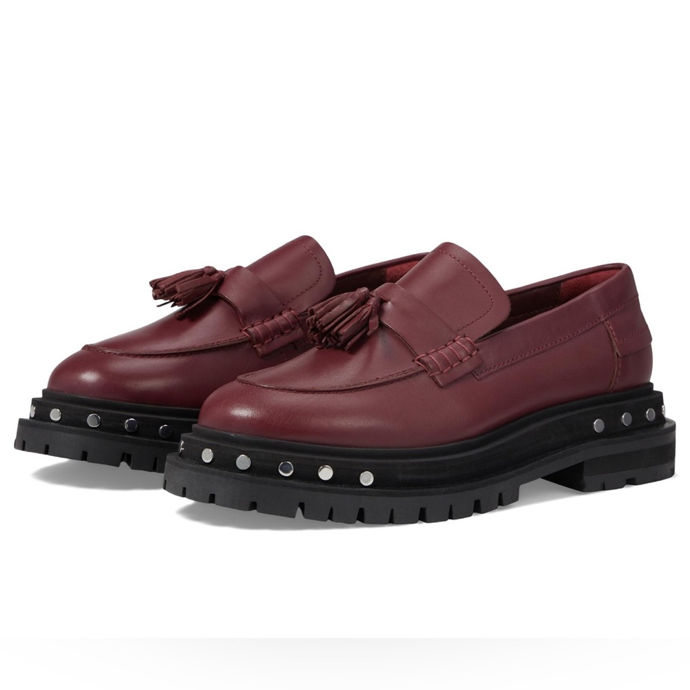 Free People Teagan Tassel Loafers with tassel accent, + stud detailing.